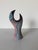 A striking 1992 vintage hand-crafted ceramic sculptural vase featuring an elegant open-form silhouette with a bold...