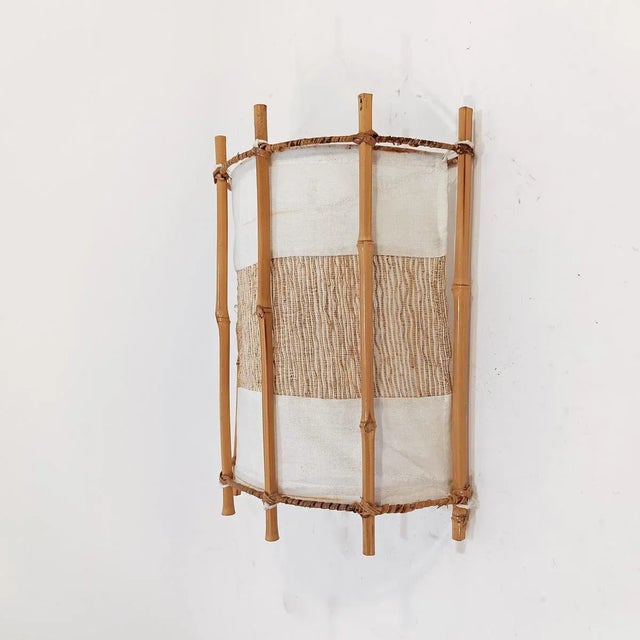 Wall light designed by French architect Louis Sognot and made in Italy, 1960s. The structure is made of bamboo, rattan and...