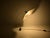 Beautiful white metal and paper table lamp by Mario Bellini. The adjustable shade allows you to direct the light in...