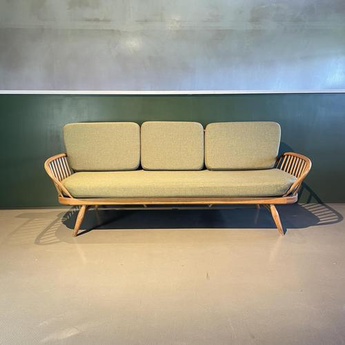 Refurbished vintage Ercol 355 Studio Couch/sofa bed in a light brown wood finish. Inspired by Scandinavian design, the...