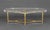 Modern Brass and Acrylic Oval Coffee Table, the base with four fluted columns conjoined by diamond form stretcher. 17" H x...