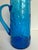 Here is a vintage Italian art glass pitcher, likely dating to the 1960s–1970s, in a vibrant cobalt blue with a molded...