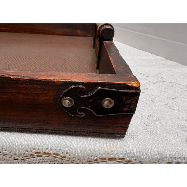 Large rustic elegant wood tray with side handles, textured tray interior, aged hardware and faux leather accents. Perfect...
