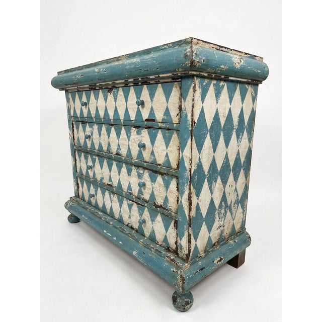 A striking vintage Italian chest of drawers that effortlessly bridges the gap between classic European elegance and...