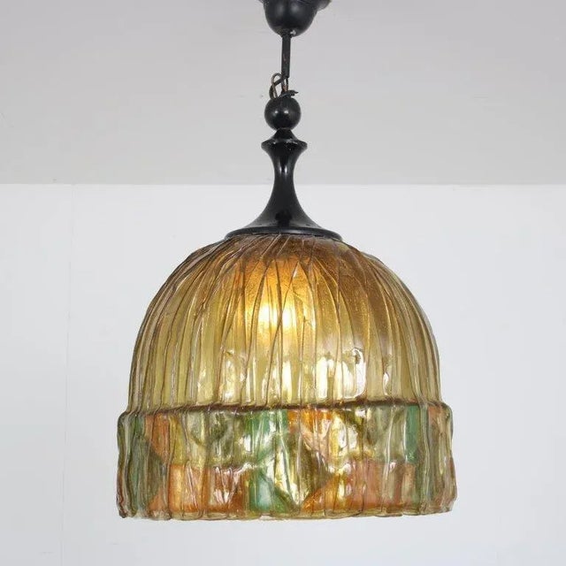 A beautiful hanging lamp manufactured in the Netherlands around 1970. Made of high quality resin in a beautiful coloured...