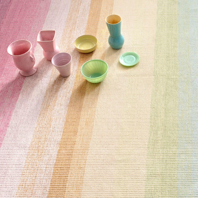 A mirage of degrade stripes in a bouquet of happy colors infuses our signature flat weave cotton rug in a vibrant creative...