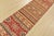 A tribal Khorjin runner hand-knotted with fine wool on a cotton foundation. This rug features multicolored stripes adorned...