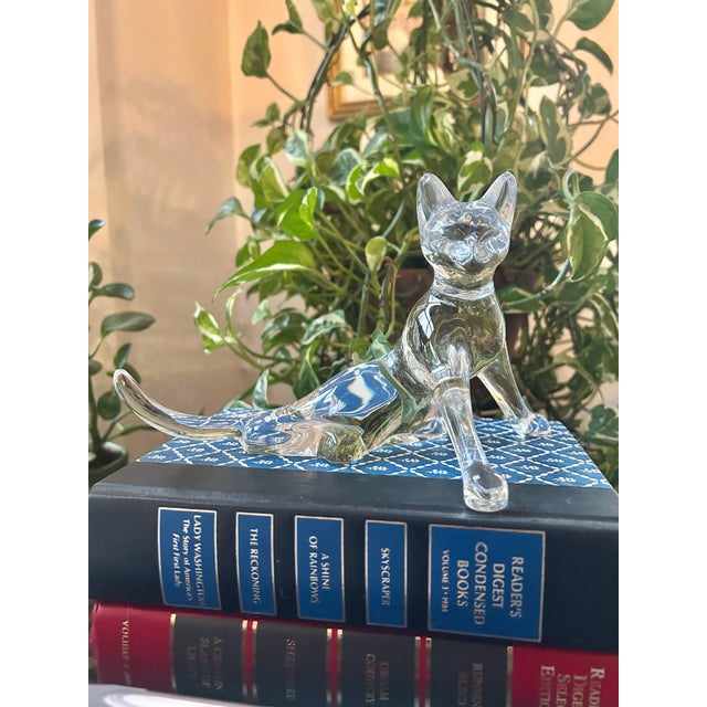 “Chat a L Ecoute” or “cat with tail up” describes this crystal cat figurine. The piece is made by Baccarat and is part of...
