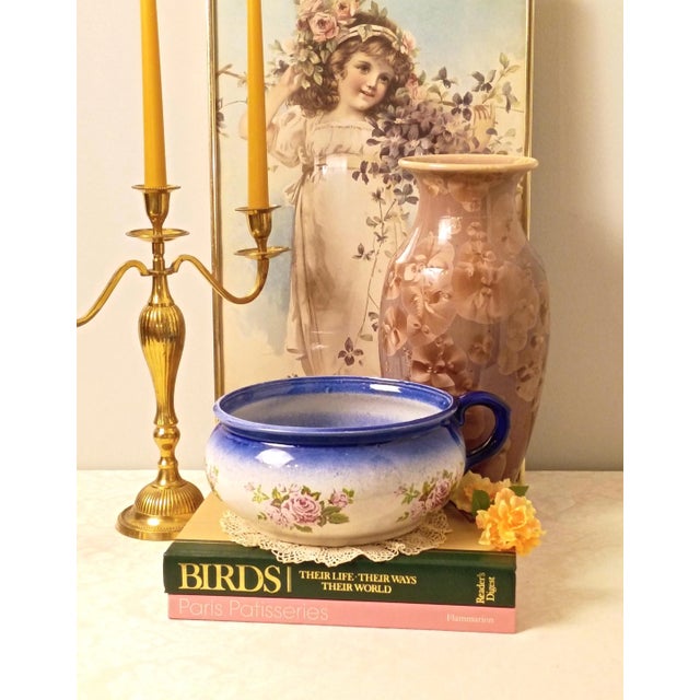 This antique ironstone chamber pot features a beautiful deep blue sponge ware gradient along the rim and handle,...