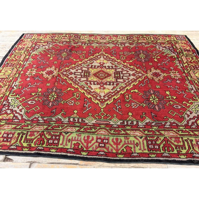 This Early 20th Century European carpet is a magnificent representation of the historic Donegal - Arts & Crafts weaving...