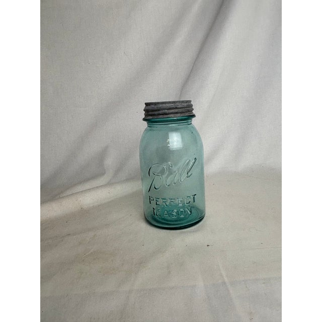 Priced per individual jar. A selection of large 1920s-1930s blue glass Ball jars (dated with logo archives) Featuring the...