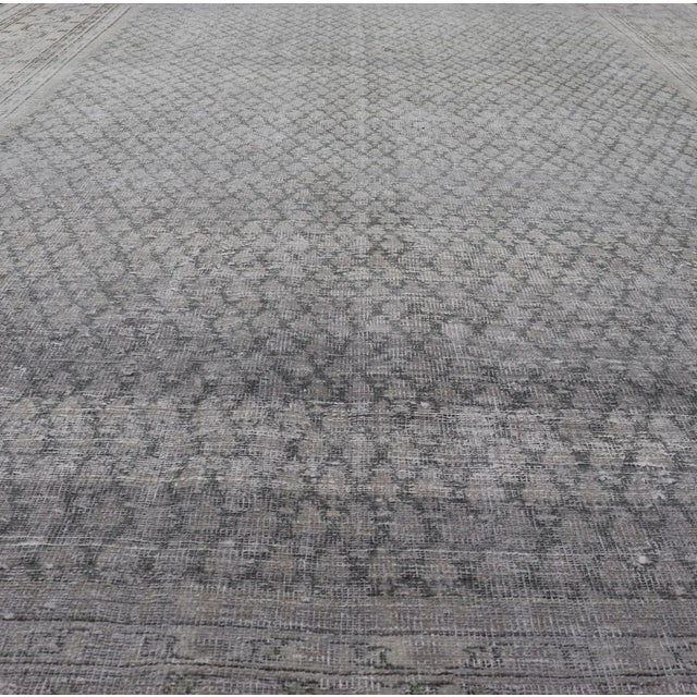 Tribal Distressed Persian Antique Tabriz Carpet With Muted Floral Design in Light Gray For Sale - Image 3 of 11