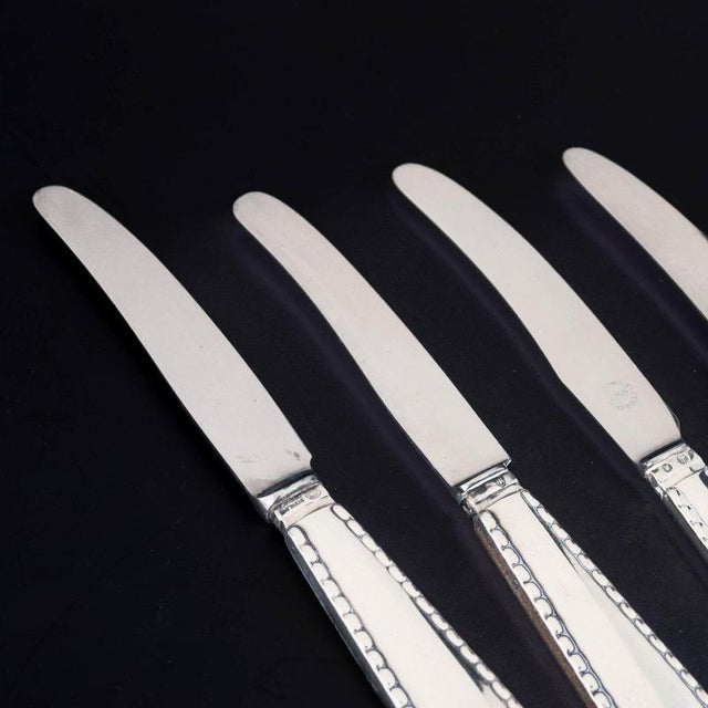 Georg Jensen, set of four knives, Beaded. Set of four knives in stainless steel and 830 silver in the Beaded pattern from...