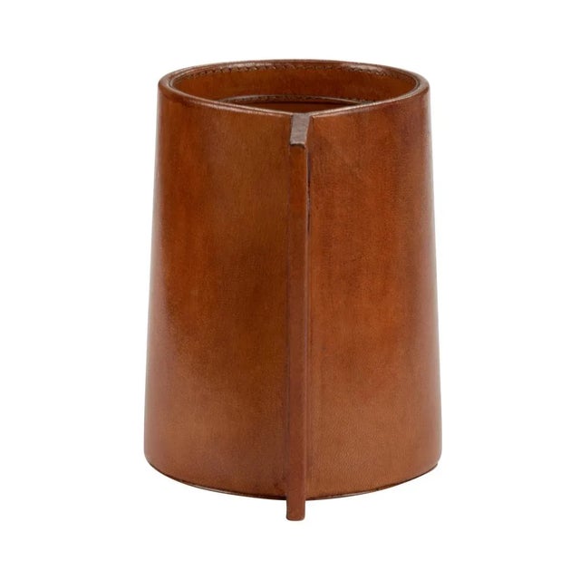 Unique and gorgeous handcrafted leather flower vase with glass insert. The leather is a classic cognac color with depth...