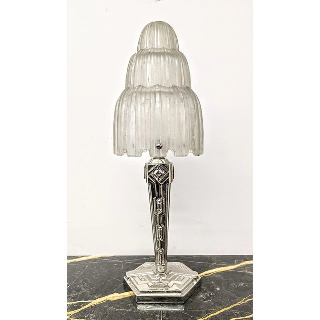 A French Art Deco table lamp known as the "Waterfall" was created in the 1930's by the French Master "Marius Ernest...