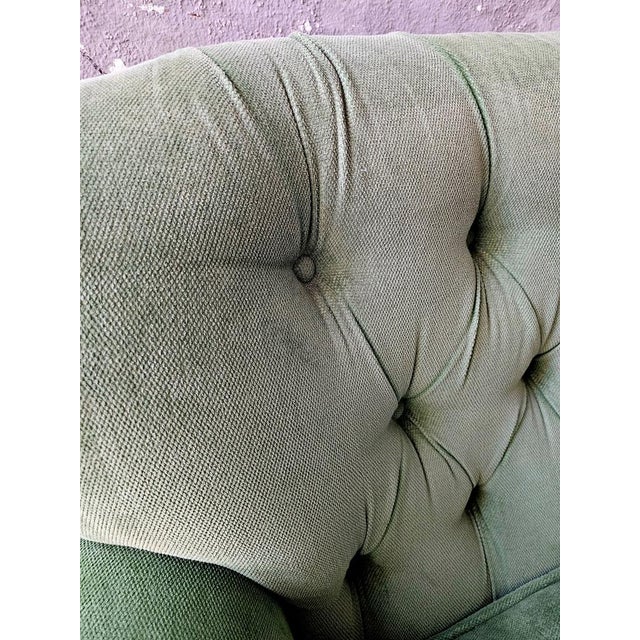 Rare pair of Chesterfield style sofas dating back to around 1960/70. Covered in green fabric from a more recent era, the...