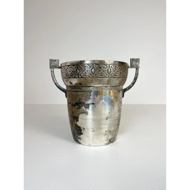 This champagne cooler is made in nickel silver and has a genuinely nice relief pattern and is crafted by hand. Good...