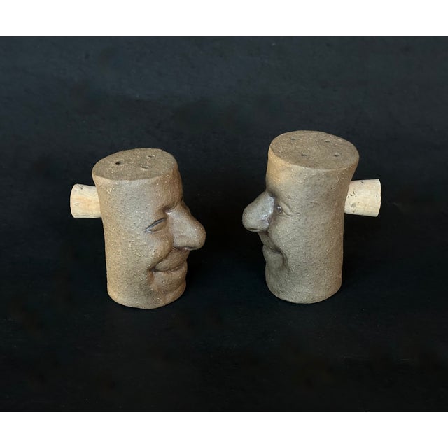 This set of funny face art pottery salt and pepper shakers are is sure to be a conversation starter at your next dinner...