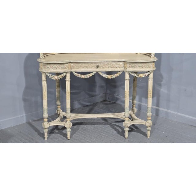 A very good French kidney shaped dressing table with double bergere back, six legs with U shaped stretcher, single drawer,...