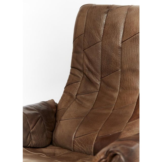 Very high quality armchair from De Sede. Covered with brown leather. The seat angle is adjustable. Very good condition. I...