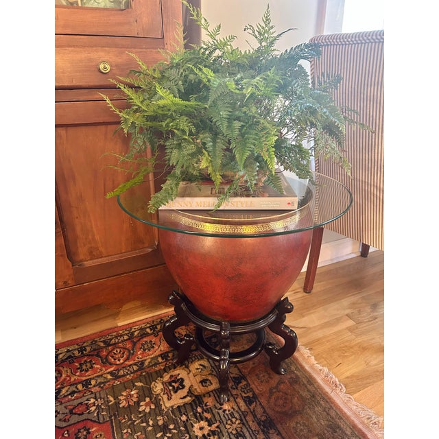 Striking and versatile, this Chinese-style porcelain fishbowl has been paired with a custom beveled glass top to create a...