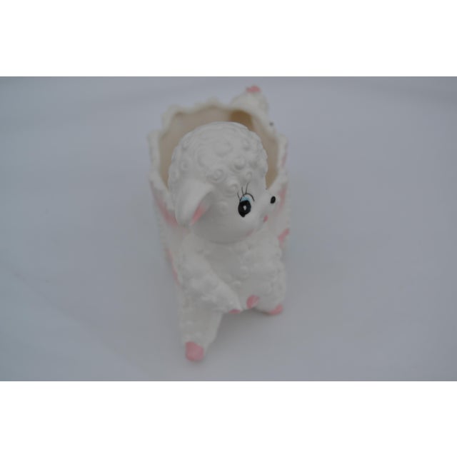 Possibly made by Nasco. This planter could be used in a nursery to hold cotton balls or a plant. It is clean inside and...