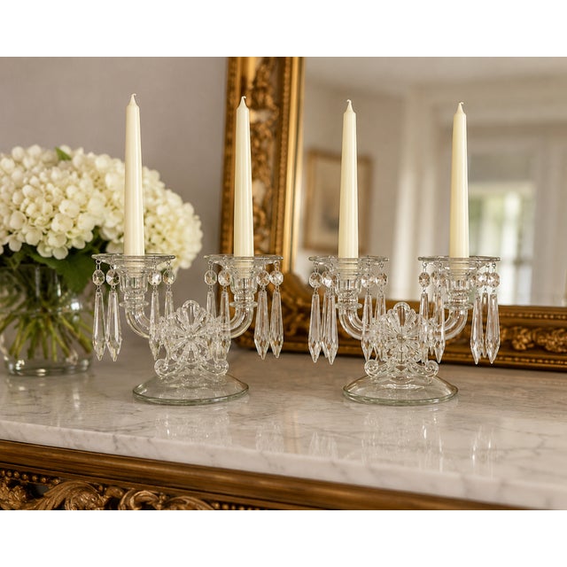 Graceful and sophisticated, this vintage pair of Hollywood Regency crystal prism candlestick holders embodies the...