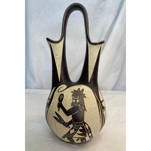 This sculptural Native American wedding vase by Arthur Lucario (Acoma / Laguna Pueblo, b. 1942) exemplifies the balance of...