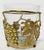 Unique vintage ice bucket with heavy cut glass insert held by a footed brass frame featuring detailed classic grape and...