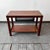 Product: coffee table style: 1990s material: mahogany veneer, black metal features: metal shelf beneath the top condition:...
