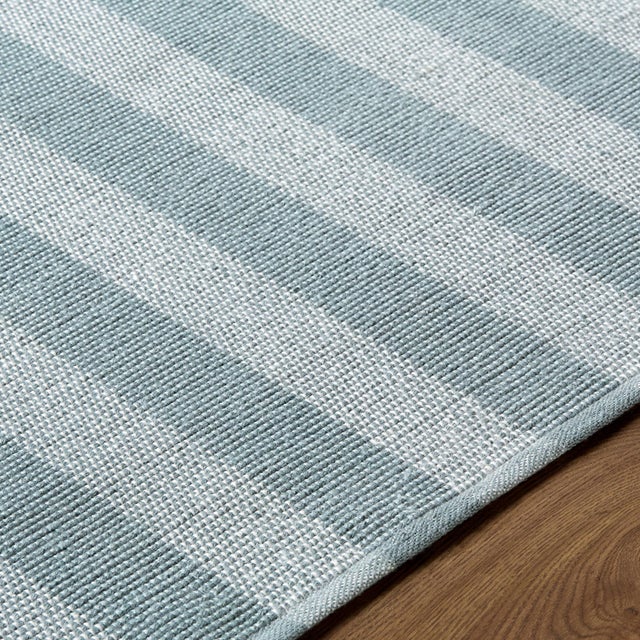 Transform your space into a serene coastal haven with the Harbor collection's exquisite handmade rug. Crafted with care in...