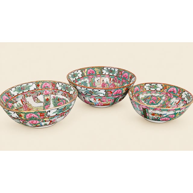 Offered is a rare set of three identical but different sized, hand painted Famille Rose porcelain bowls with finely...