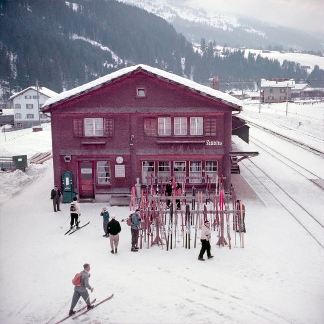 Alpine Railway Station by Toni Frissell Skis stacked up outside and alpine railway station, Klosters, Switzerland, 1951....
