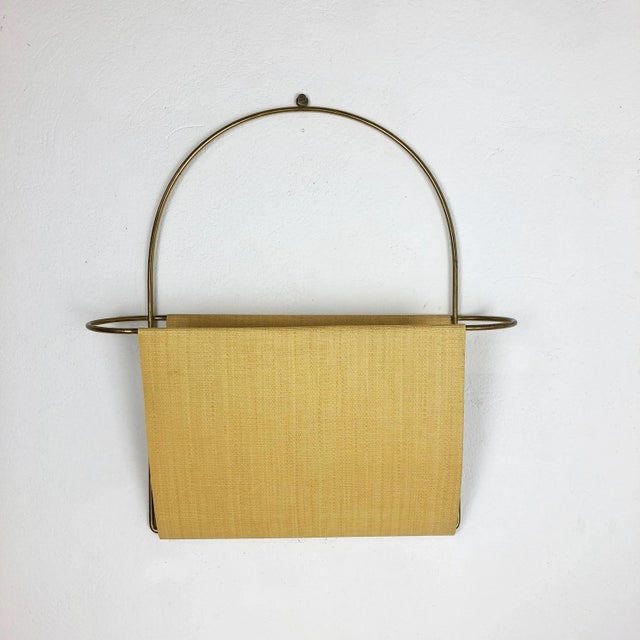 Wall magazine rack Origin: Austria Age: 1950s Original vintage wall hanging magazine rack. This element was produced in...