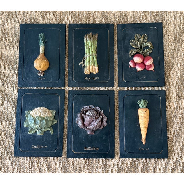 Set of 6 heavy carved trompe l'oeil vegetable wall plaques. Featuring a radish, onion, carrot, asparagus, cauliflower, red...