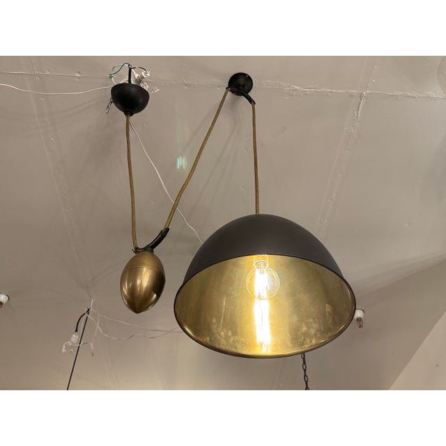 Design Plus Gallery presents the Egg Drop Mini Pendant from Barry Dixon for Arteriors. This adjustable fixture is weighted...