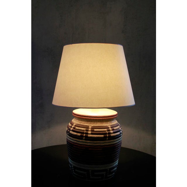 Illuminate your space with this tribal, Boho Chic ceramic lamp. It combines bold geometric patterns with warm, earthy...