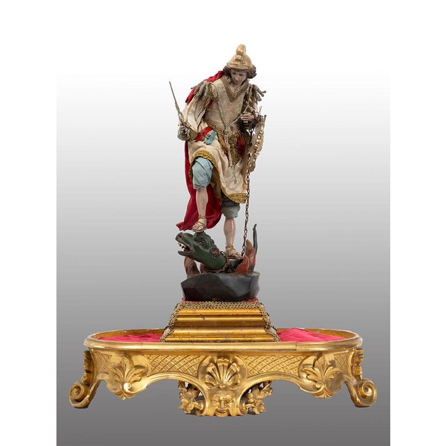 Description: Neapolitan sculpture depicting "Saint Michael the Archangel," featuring a terracotta head with crystal eyes...