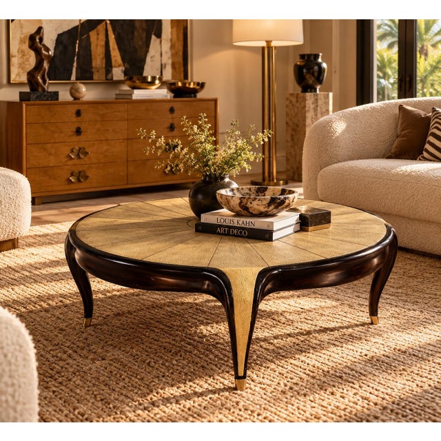 Elegant vintage Art Deco style round coffee table featuring a beautifully textured cream-colored shagreen top with a...