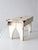 An antique early 20th century American farmhouse step stool with a beautifully worn white painted finish and a simple...