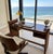 Stunning restored rattan and mahogany desk/entry table. Beautifully finished to enhance the charm and glow of this Paul...