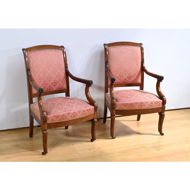 This pair of mahogany armchairs is an exquisite example of mid-19th century craftsmanship. The traditional seats are...