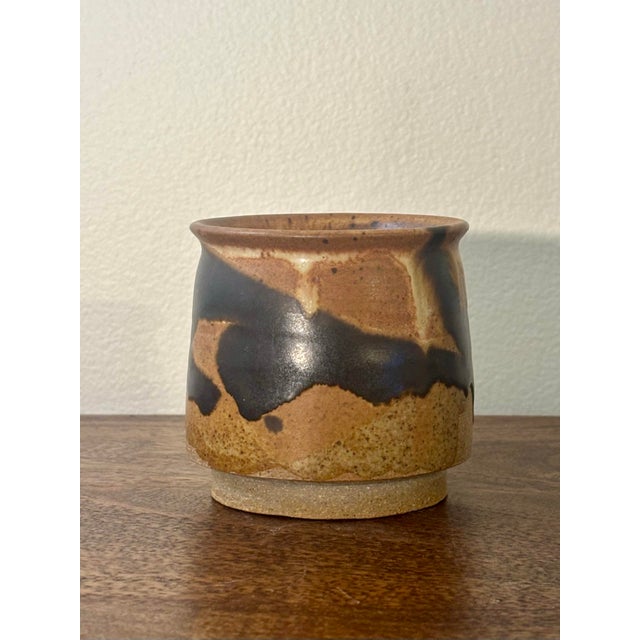 This vintage studio pottery vessel dates to November 1994 and reflects a thoughtful balance of weight, tactility, and...