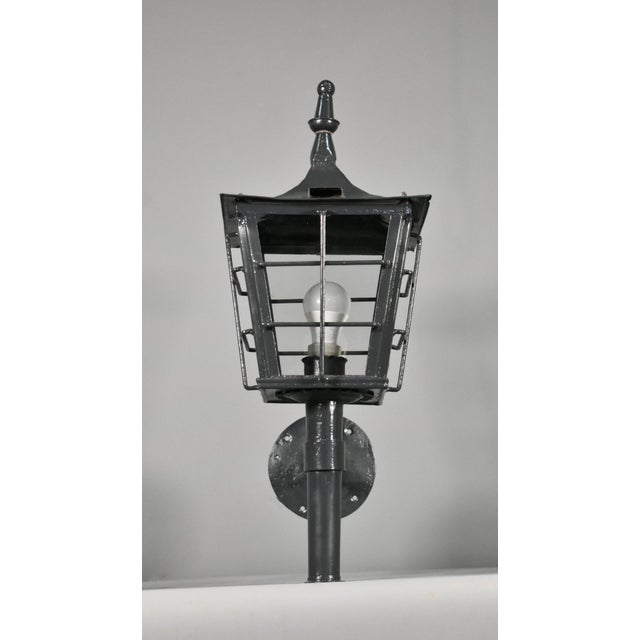 A characterful French exterior lantern in steel, dating from the early 20th century of simple and sturdy architectural...