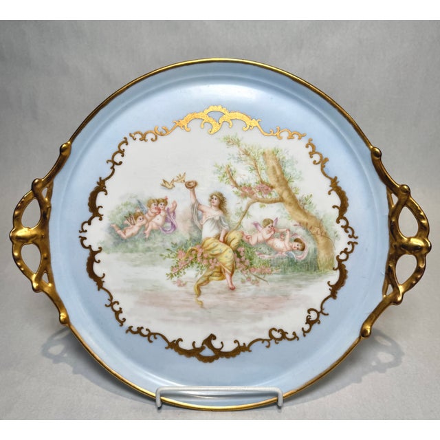 An exceptional antique French Limoges porcelain tray, bearing the marks CFH and GDM, finely hand-painted with a romantic...