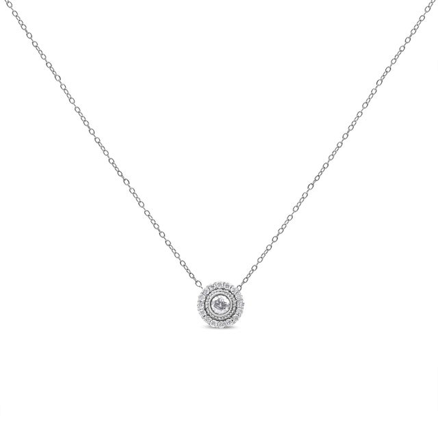 Strike a pose in this alluring diamond halo circle pendant necklace crafted of .925 sterling silver. This piece is a...