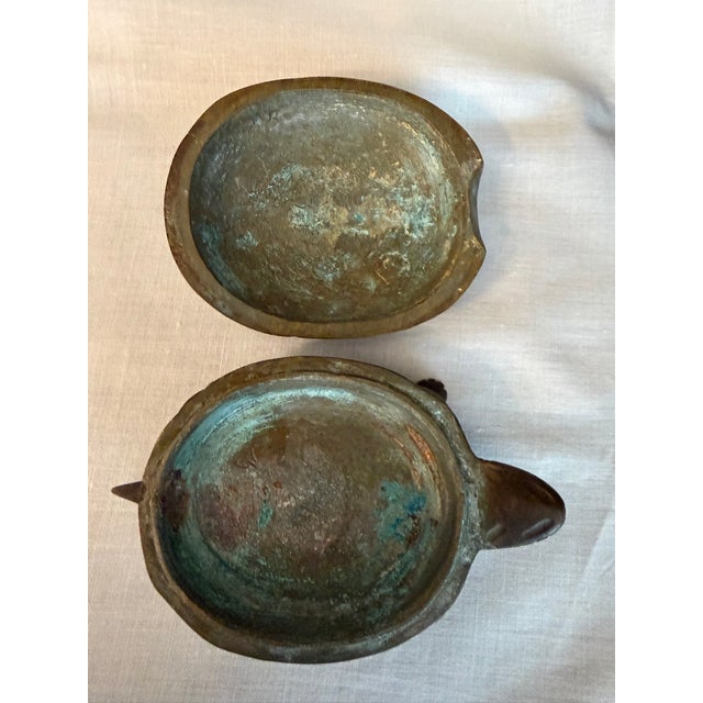 Purchased in China 1970 from a gift store. Metal is unknown, Shell fits very snug and removed easily. Nice detail overall...