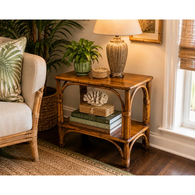 Bring timeless coastal charm to your home with this vintage bamboo two-tier side table. Crafted with a beautifully aged...