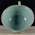A charming small Chinese ceramic pouring bowl or cup. The vessel features a flared rim, a small pouring spout, and a...