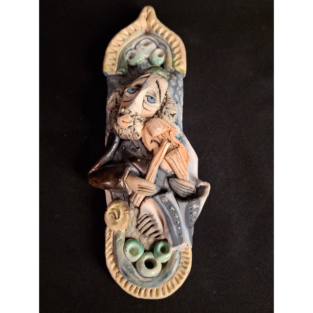 Presenting a fine example of Israeli studio pottery Judaica: an artfully sculpted ceramic mezuzah case by the recognized...
